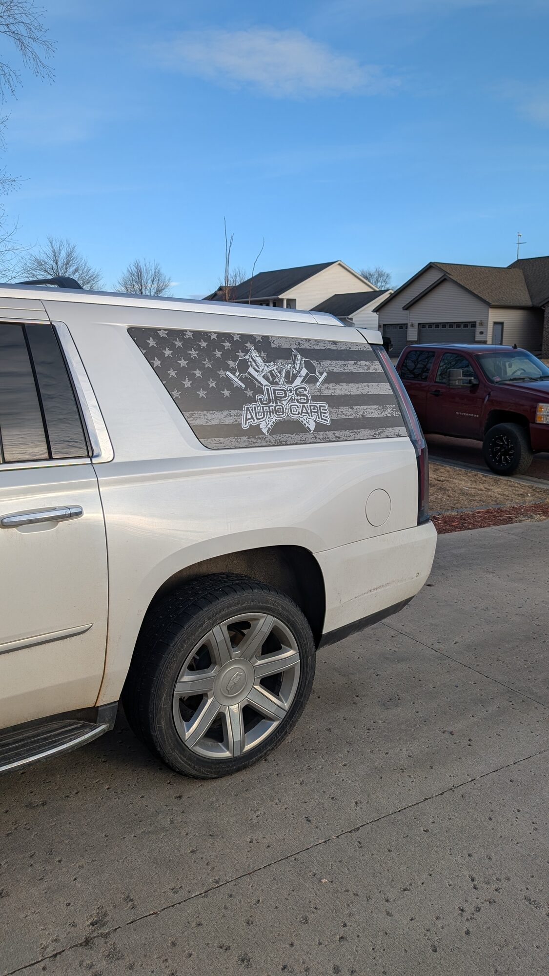 JP's Auto Care custom vehicle wrap on white SUV